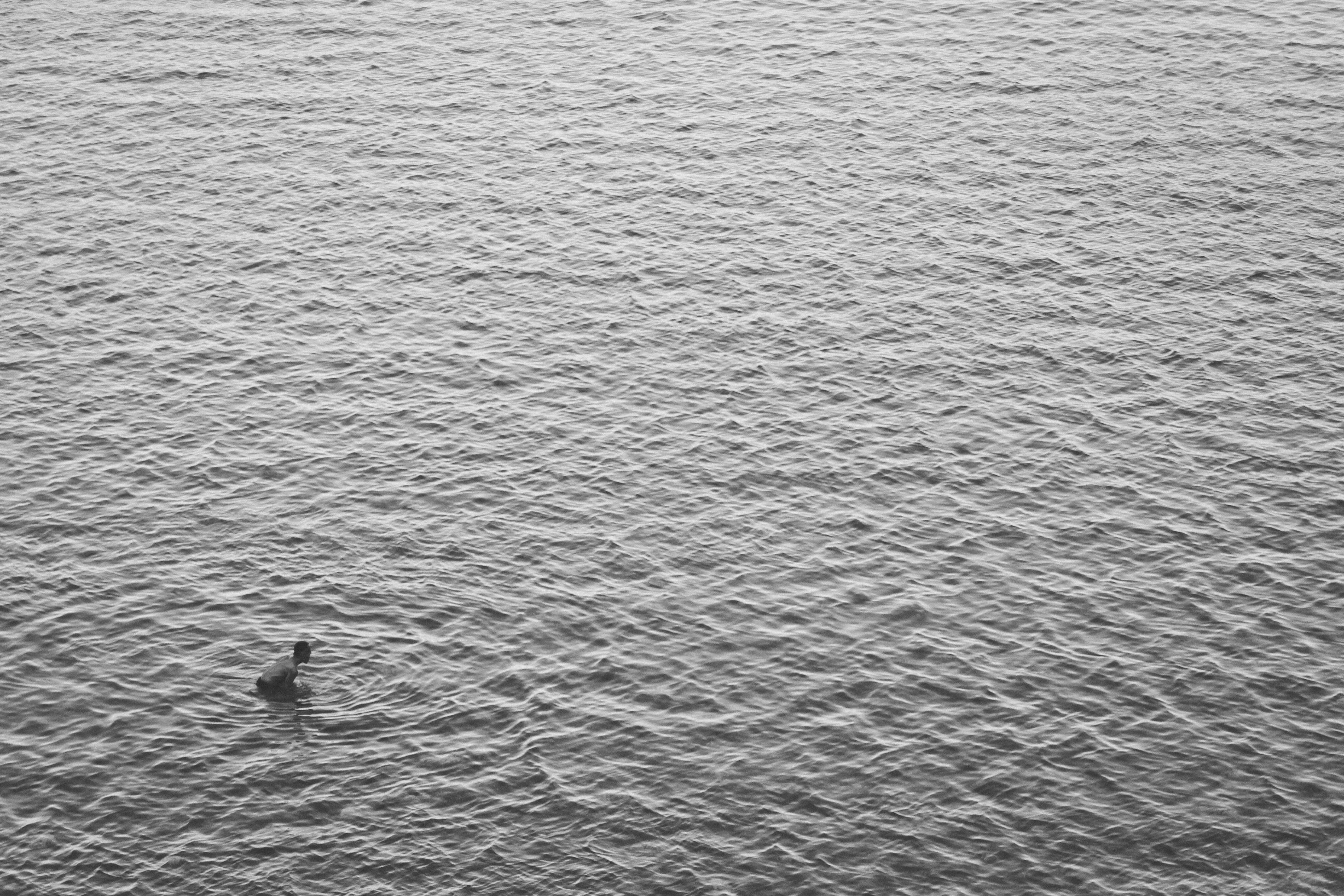 aerial view photography of person in ocean during daytime